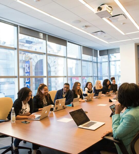 Executive presenting IT strategy to leadership team in a modern boardroom — Valukoda True CIO services